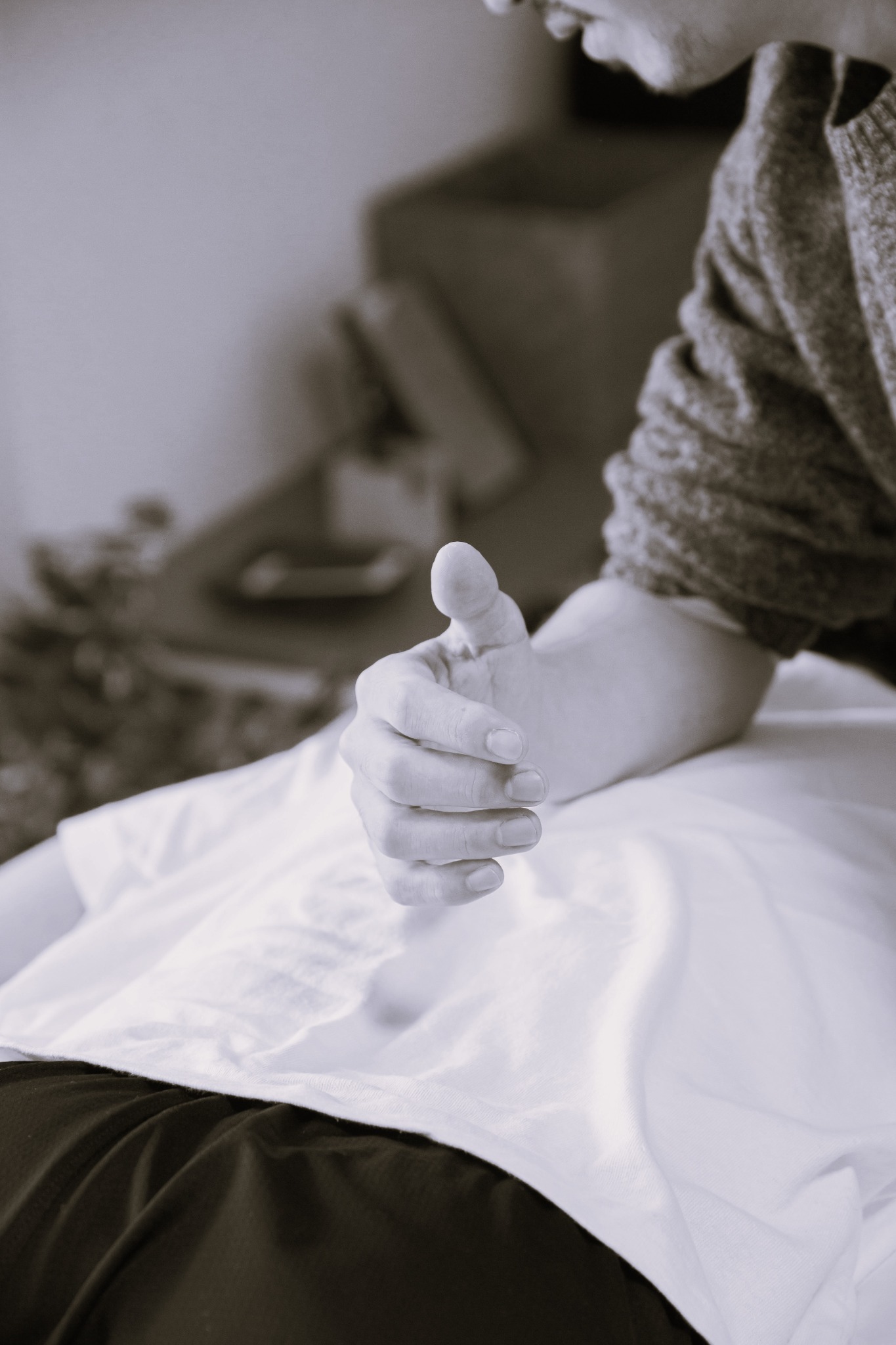 Hand resting on the hara — the abdominal centre associated with breath and grounding in Japanese bodywork